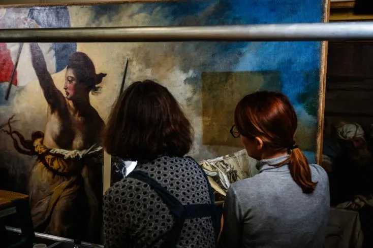 Restorers at work on Liberty Leading the People